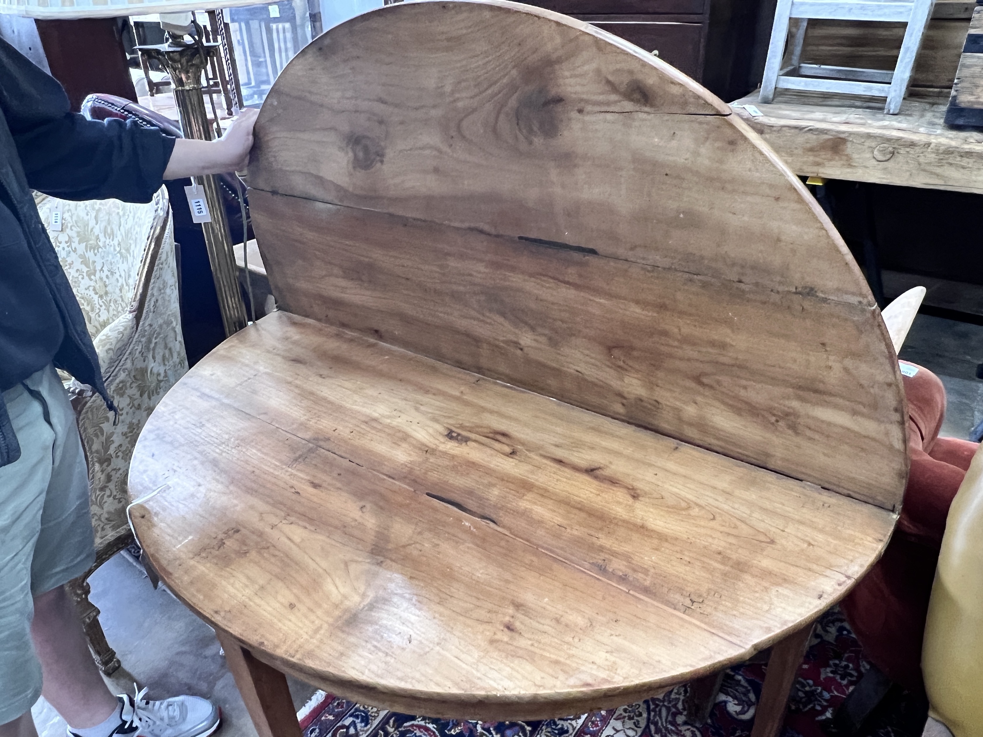 An early 19th century continental fruitwood D shaped folding tea table, width 124cm, depth 60cm, height 73cm